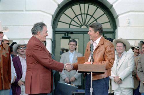 Louis and Kathy L'Amour C17215-24, President Reagan greeting author Louie L'Amour at Barbecue for Professional Rodeo Co…