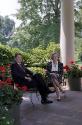 C41802-21, President Reagan and Prime Minister Thatcher of the United Kingdom talk on the patio…