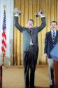 C6143-24, President Reagan lifting weights, with George Allen looking on, during a reception fo…