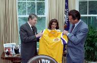 C48142-11A, President Reagan in a photo opportunity with Los Angeles Lakers basketball coach Pa…