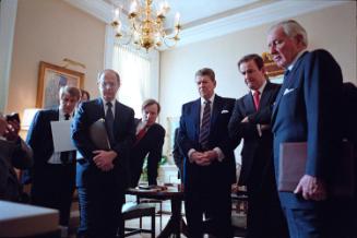 C33089-18, President Reagan and his staff watch televised replay of the Space Shuttle "Challeng…