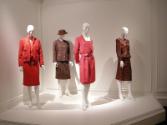L to R: red Chanel suit, plaid Chanel suit, red polka dot Valentino dress, and red brocade Adol…