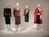 L to R: Valentino suit with bow, plaid Yves Saint Laurent suit, orange and rust Galanos ensembl…